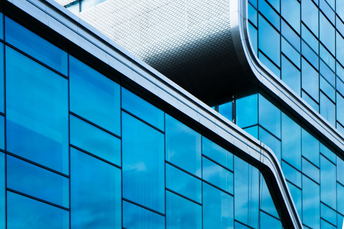 Modern construction facade with blue glass